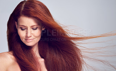 Buy stock photo Ginger, beauty and woman with hair care for red color in studio, background and mockup. Cosmetics, dye and calm girl with natural shine and healthy hairstyle in wind with makeup or skincare on face