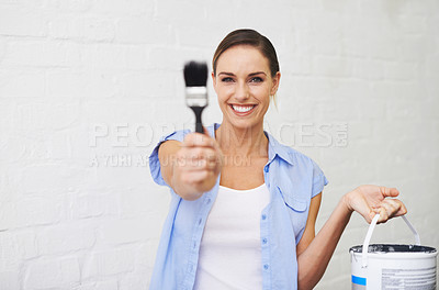 Buy stock photo Portrait of a smiling woman holding a paint brush and paint can