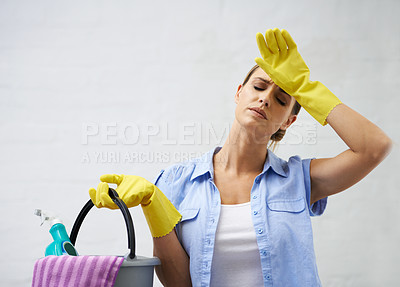 Buy stock photo Woman, cleaning and tired for housekeeping in home, bleach and detergent for sanitation or disinfection. Female person, exhausted and maid for sterilization, supplies and rubber gloves for hygiene