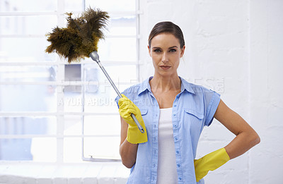 Buy stock photo Feather, duster and portrait of woman cleaning in house, home or hotel with confidence. Housework, mission and serious girl, housekeeper or cleaner service for dirt, germs and sanitation in apartment