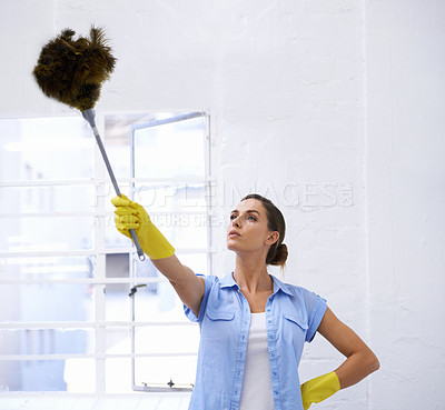 Buy stock photo Woman, cleaning and duster for housekeeping in home, feather and worker for sanitation or disinfection. Female person, supplies and maid for sterilization, equipment and rubber gloves for hygiene