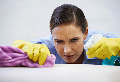 Buy stock photo Woman, gloves and spray for cleaning table in home, disinfection and remove dirt or bacteria and dust. Female person, housekeeeping and wash with detergent or sanitation, maid and chemical for germs