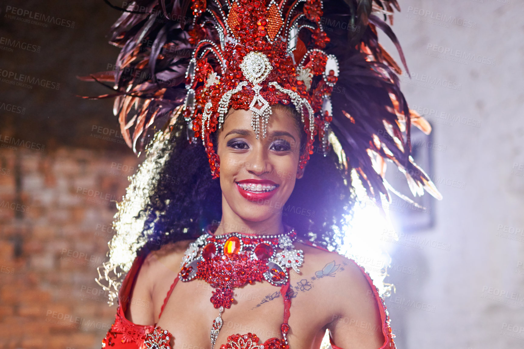 Buy stock photo Portrait, costume and carnival for Brazilian female dancer, celebration and traditional festival. Dance, smile or samba for performance in Rio De Janeiro, headdress or concert for Mardi Gras
