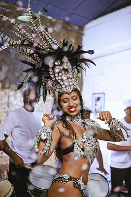 Buy stock photo Celebration, party and exotic female dancer dancing with a band at mardi gras or cultural festival. Performance, costume and woman performing a dance with rhythm to live music at a carnival in Brazil