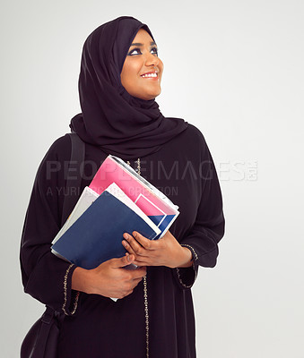 Buy stock photo Muslim, student and thinking with an islamic girl holding books in studio on a gray background for education. Idea, learning and islam with a female pupil on a scholarship to study at university