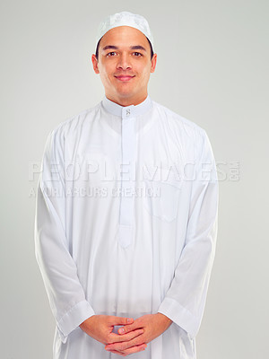 Buy stock photo Portrait, muslim and faith with an islamic man in studio on a gray background for religion, belief in god or devotion. Eid, worship and ramadan with a male arab fasting in holy tradition or culture