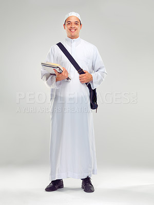 Buy stock photo Young muslim man, islamic clothes and standing for religious studying, worship or spiritual happiness in white background. Arabic student, happy and religion fashion or culture isolated in studio