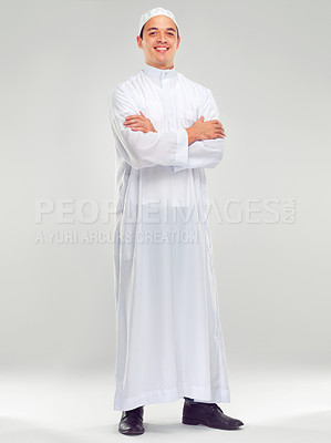 Buy stock photo Islamic man, smile portrait and muslim fashion standing in white background for Arabic culture. Young person, smile and religion faith, worship or religious mindfulness standing isolated in studio