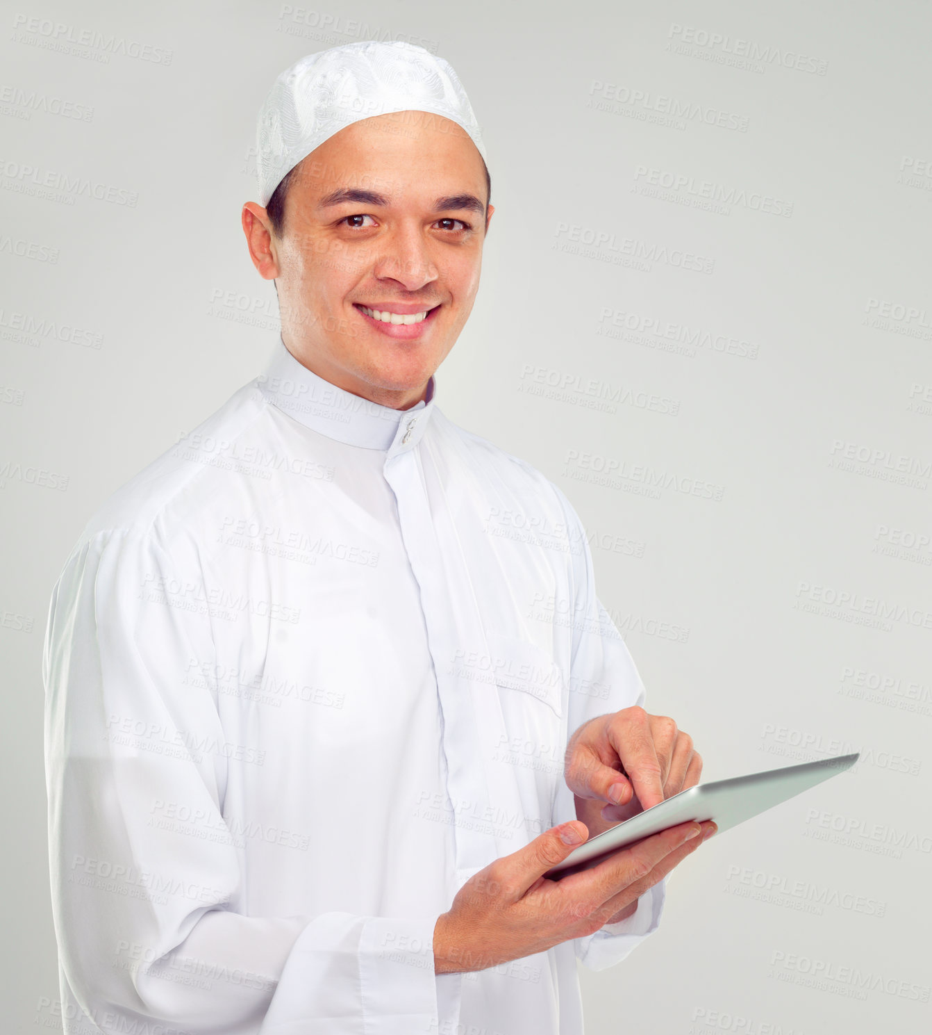 Buy stock photo Islamic man, tablet and happy portrait for Muslim reading, education or culture standing in white background. Young person, smile and digital tech learning for religious mindset isolated in studio