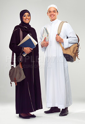 Buy stock photo Portrait, smile and Arabic students with education, knowledge and people isolated on white studio background. Islamic, man and woman in traditional clothes, learning or confident with books and smile
