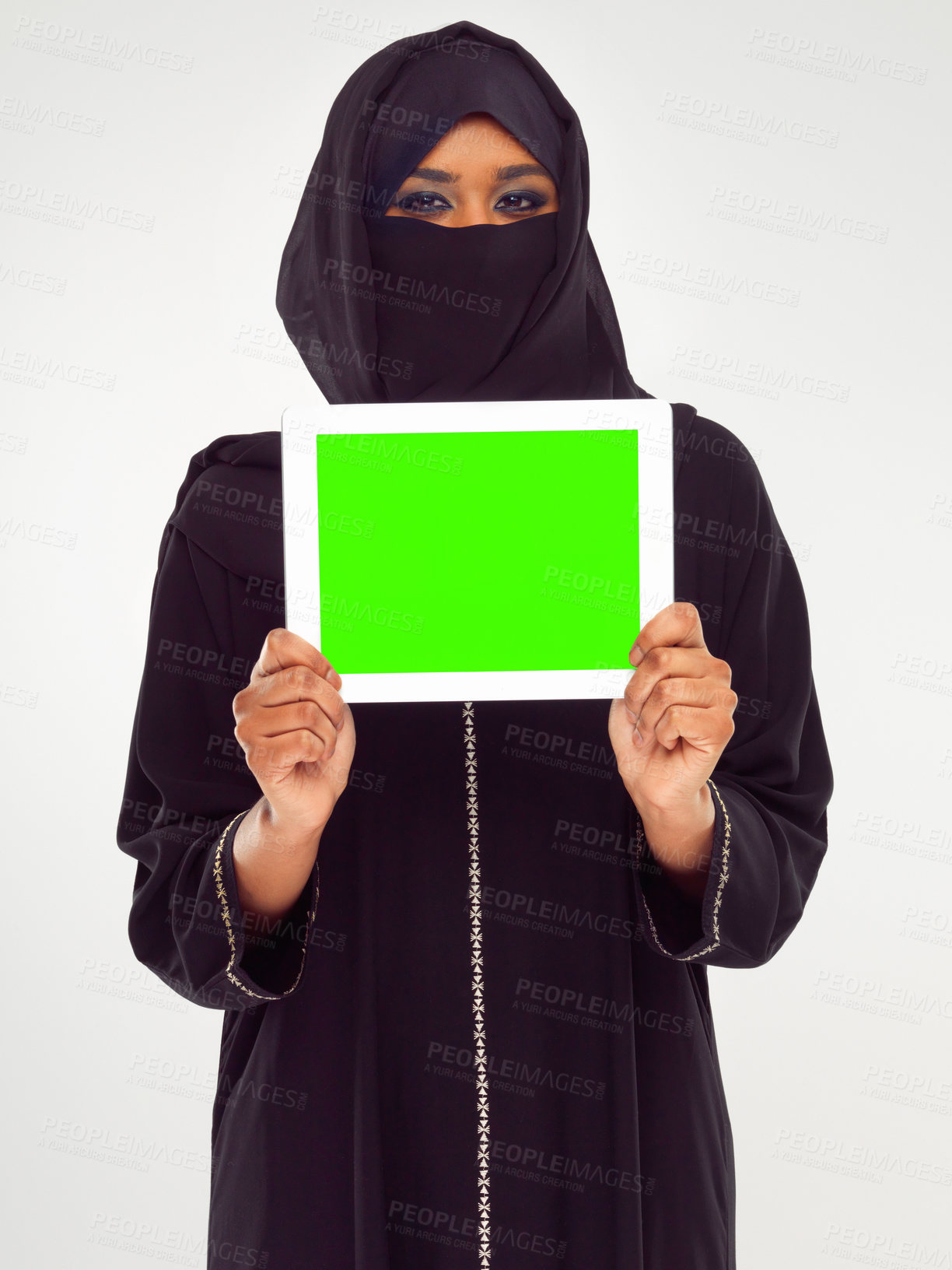 Buy stock photo Muslim woman, tablet and green screen for marketing, advertising or mockup against a grey studio background. Portrait of woman in hijab holding touchscreen with green chromakey screen or display