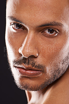 Buy stock photo Portrait, skincare and man in studio closeup for wellness, dermatology or skin cleaning on black background. Face, water and male model with masculine beauty, cosmetics or facial splash treatment