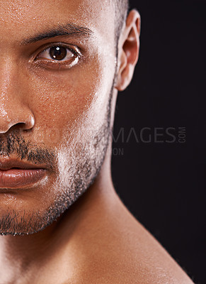 Buy stock photo Skincare, man and half portrait in studio zoom for wellness, dermatology or skin cleaning on black background. Face, water and male model with masculine beauty, cosmetics or facial splash treatment