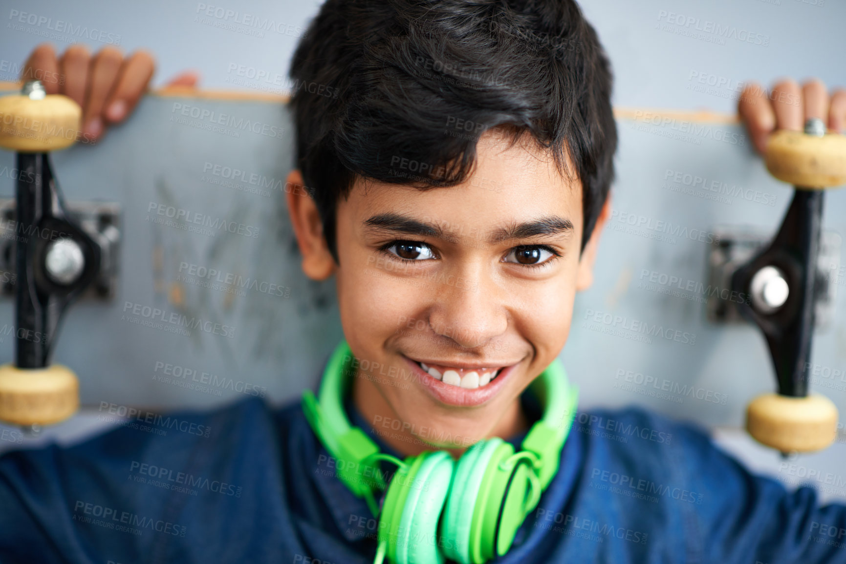 Buy stock photo Portrait, smile and boy with skateboard, headphones and happiness with music and cheerful. Kid, face and childhood with skater or headset with joy and hobby with recreation and gen z with confidence