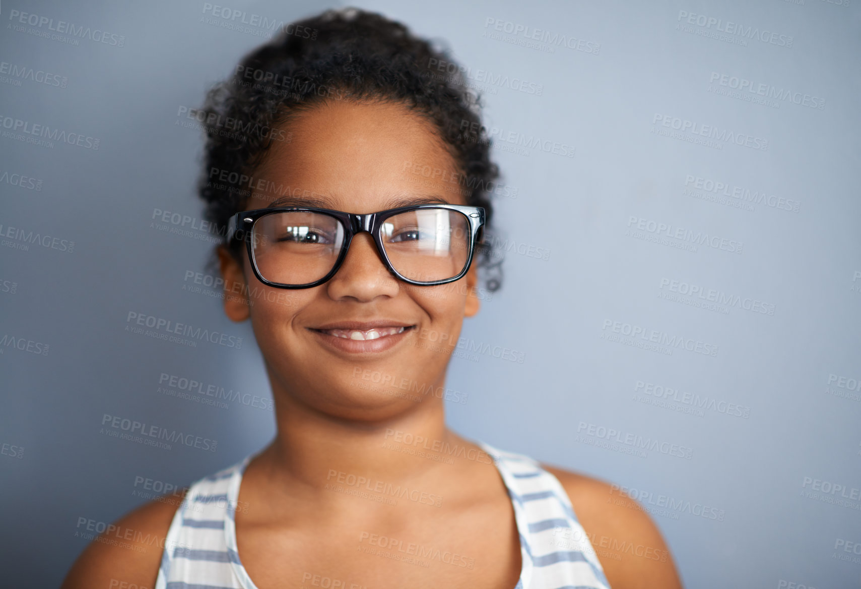 Buy stock photo Happy child, girl and portrait in studio with glasses, education and pride in school or academic excellence. Kid, face and smile in prescription eyewear to support learning, eyecare and ophthalmology