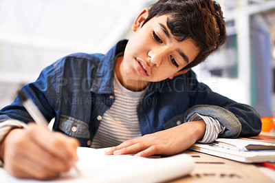 Buy stock photo Image of a young boy doing his homework