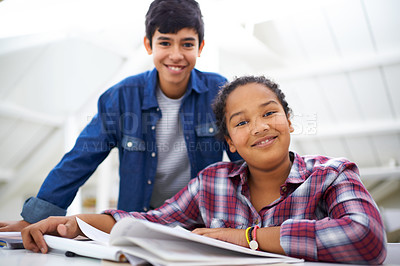 Buy stock photo Children, books and studying for education in portrait, learning and writing homework for school. Happy kids, reading and teamwork for support in desk, brother and sister with notebook in study space