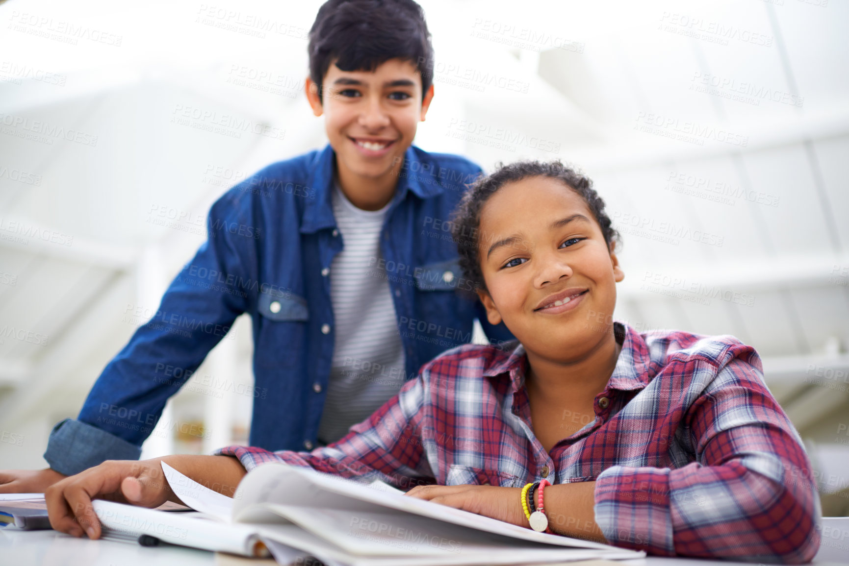 Buy stock photo Children, books and studying for education in portrait, learning and writing homework for school. Happy kids, reading and teamwork for support in desk, brother and sister with notebook in study space