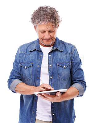 Buy stock photo Tablet, typing and senior man in studio networking on social media, app or internet for communication. Research, browsing and elderly male person scroll on digital technology by white background.