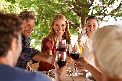 Buy stock photo Family, lunch and cheers with happiness, celebration and bonding together with joy and weekend break. Group, generations and parents with girl and daughter with food and drinks with meal and relaxing