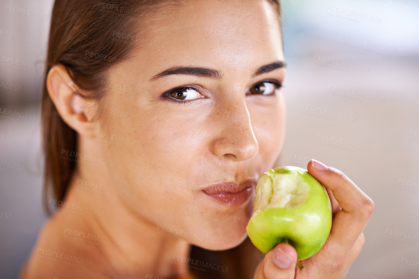 Buy stock photo Woman, portrait and apple for nutrition in home, organic fiber and fruit for wellness. Happy female person, vitamins and minerals for healthy living, eating snack and vegan food in closeup for diet