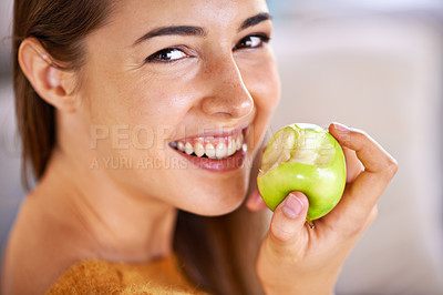 Buy stock photo Woman, portrait and apple for hunger in home, organic fiber and fruit for wellness. Happy female person, vitamins and minerals for healthy living, eating snack and vegan food in closeup for diet