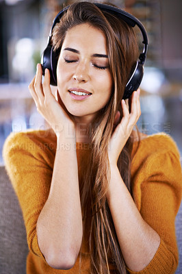 Buy stock photo Woman, headphones and listening to audio on couch, relax and streaming radio for music or sound. Female person, home and chill on sofa for peace, comfortable and hearing jazz playlist on weekend