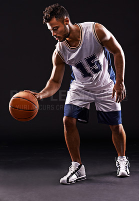Buy stock photo Man, playing and basketball player in studio for sports athlete for workout competition, training or black background. Male person, bounce and exercise performance or professional, fitness or mockup