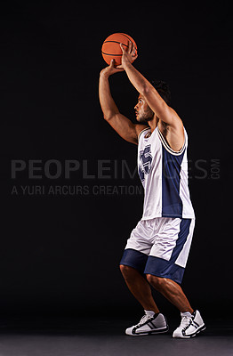 Buy stock photo Man, shoot and basketball player in studio for game goals or workout competition, training or black background. Male person, playing and exercise performance or professional, fitness or mockup space