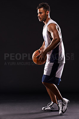 Buy stock photo Man, basketball player and playing game in studio as athlete for workout competition, training or black background. Male person, sports and exercise champion or professional, fitness or mockup space