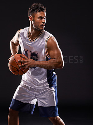 Buy stock photo Studio shot of a basketball player against a black background