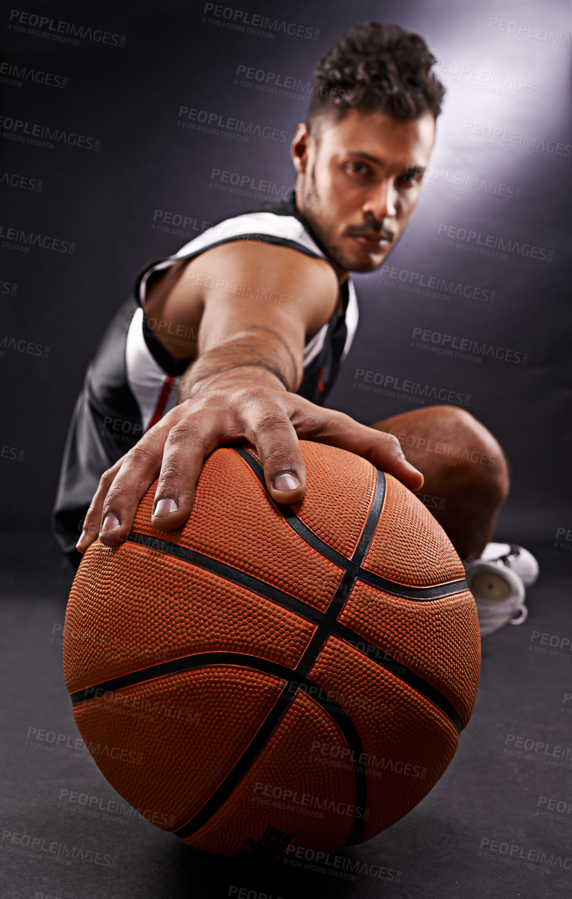 Buy stock photo Man, portrait and basketball playing for sports game in studio or professional exercise, athlete or black background. Male person, training and fitness pride or workout competition, uniform or mockup