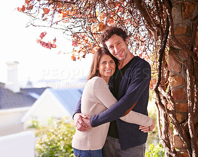 Buy stock photo Smile, nature and portrait of couple hugging by tree in backyard garden at modern home. Happy, love and mature man and woman embracing with care in outdoor park or field for fresh air together.
