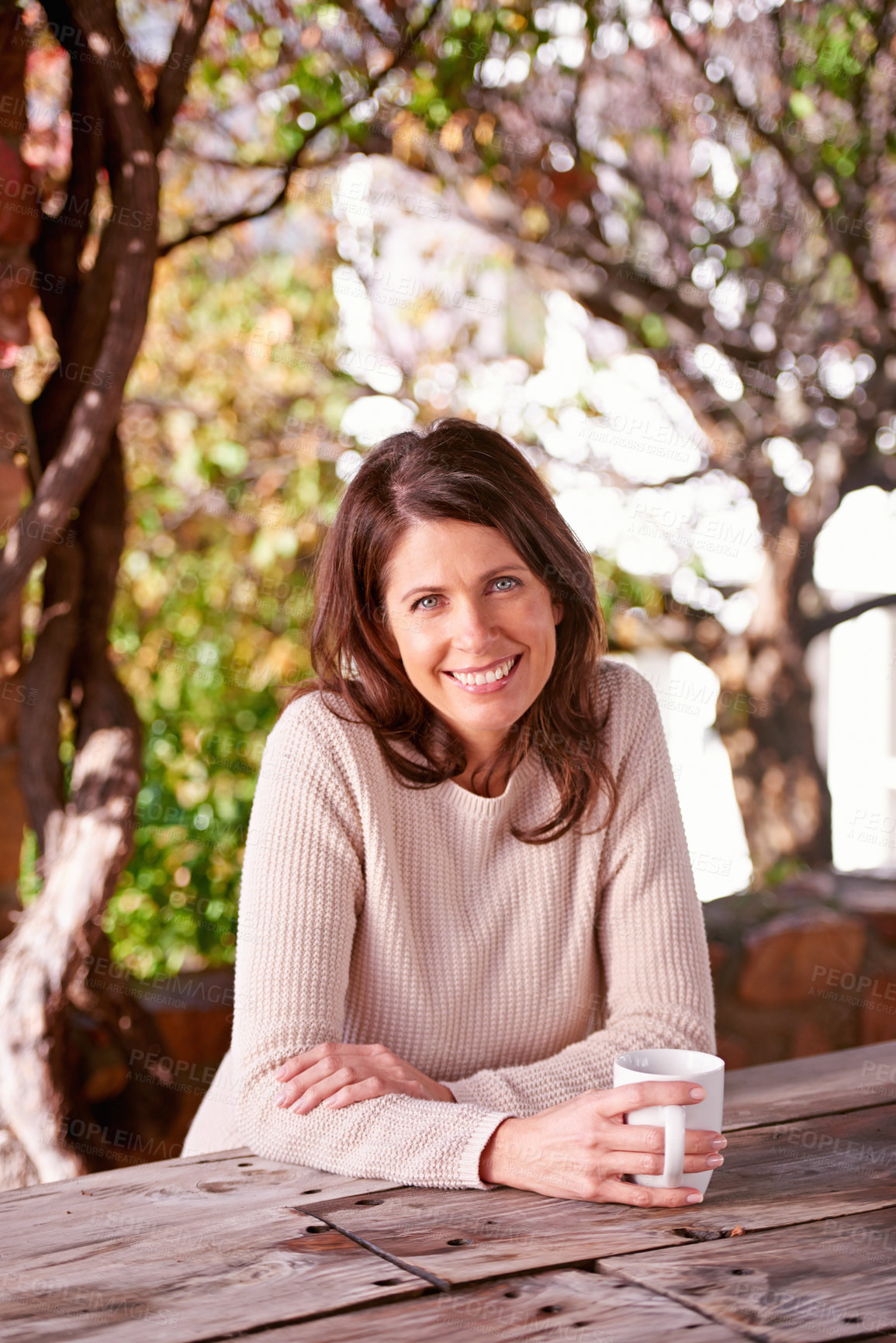 Buy stock photo A portrait of a beautiful woman having coffee in her garden