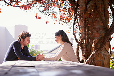 Buy stock photo Outdoor, spring and couple holding hands on table in nature, environment and together for romance. Partners, woman and man with compassion from girl, care and touch for love in marriage and park