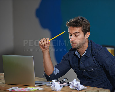 Buy stock photo Crumpled, paper and man at laptop thinking for creative ideas, online research and brain fog in office. Brainstorming, computer and frustrated designer at desk with professional career at startup
