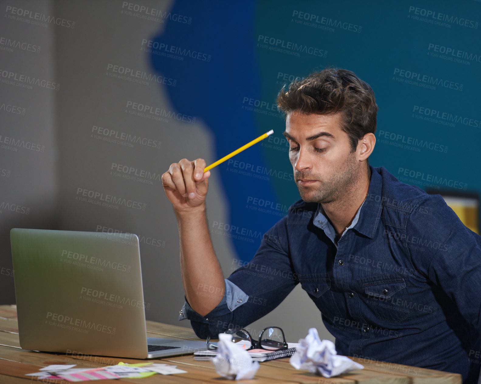 Buy stock photo Crumpled, paper and man at laptop thinking for creative ideas, online research and brain fog in office. Brainstorming, computer and frustrated designer at desk with professional career at startup