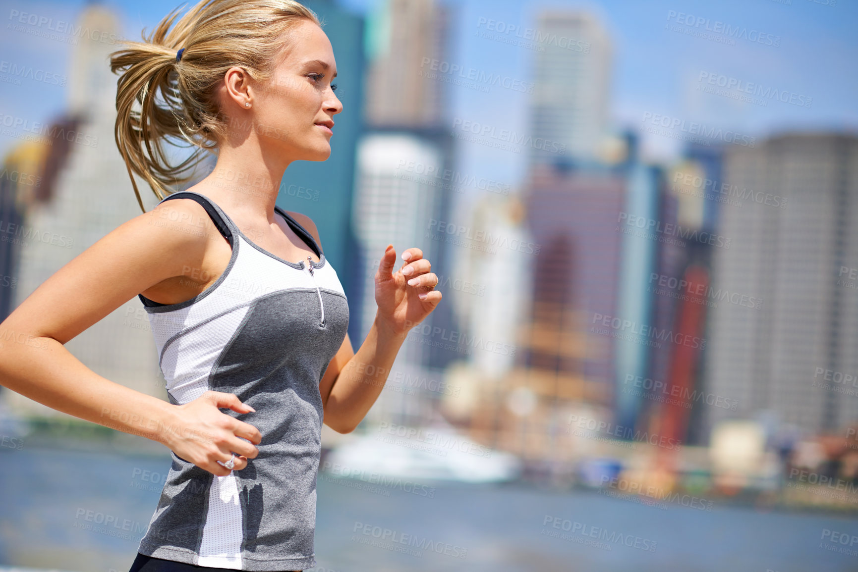 Buy stock photo Woman, strong and running for fitness in city, jogging active and fit female person exercising in New York. Energy, marathon for sports training and workout for athlete, cardio for endurance