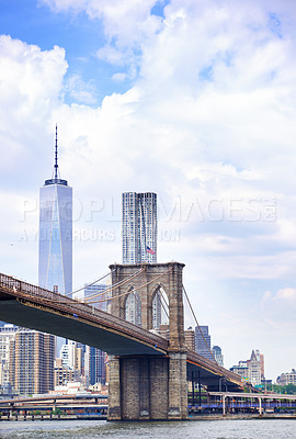 Buy stock photo Architecture, bridge and river in city with landscape, urban background or cloudy sky for transportation. Infrastructure, water or steel structure in nature with construction, development or scenery
