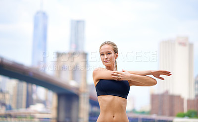 Buy stock photo Woman, stretching arms for workout in city for wellness or wellbeing, physical health and stress relief. Girl active to warm up muscle, exercise and fitness for sports runner or athlete in New York.