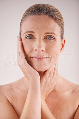 Buy stock photo Natural, portrait or mature model with beauty, confidence or pride in studio on white background. Facial treatment, skincare benefits or proud woman with glow, shine or anti aging cosmetics results