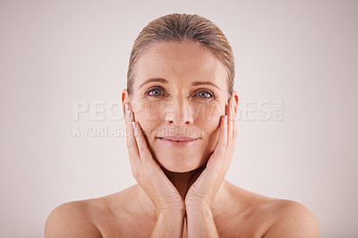 Buy stock photo Portrait, senior woman and face for cosmetic wellness or touching her perfect skin or isolated and on grey background. Mature lady, massaging wrinkles and facial aging or dermatology and skincare 