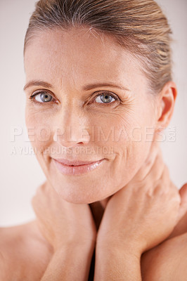 Buy stock photo Glow, portrait or mature woman with beauty, confidence or facial treatment in studio on white background. Face, skincare benefits or model with natural shine, smile or anti aging cosmetics results