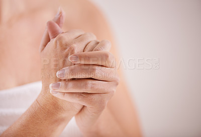 Buy stock photo Woman, hands or lotion application for beauty, skincare or cosmetics for moisturiser or anti aging product. Fingers, closeup or person with smooth skin, creme or cream for glow or dermatology in home