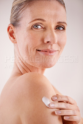 Buy stock photo Mature woman, cream and studio with skincare, portrait and cosmetic with treatment. Model, beauty and luxury with body, cosmetics and care for anti aging and healthy skin for wellness and confidence