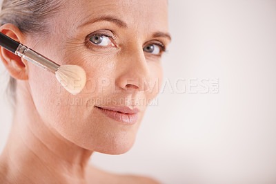 Buy stock photo Brush, beauty and portrait of woman in studio for cosmetic, self care and facial glow routine. Makeup, foundation and mature person with cosmetology tool for treatment by white background with mockup