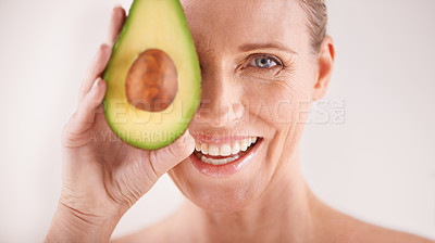 Buy stock photo Skincare, smile and portrait of woman with avocado in studio for health, wellness or natural routine. Glow, beauty and mature person with organic fruit for dermatology treatment by white background.