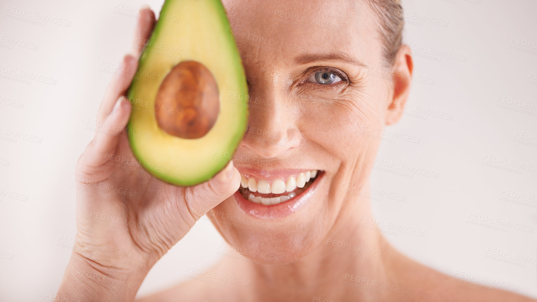 Buy stock photo Skincare, smile and portrait of woman with avocado in studio for health, wellness or natural routine. Glow, beauty and mature person with organic fruit for dermatology treatment by white background.