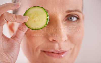 Buy stock photo Beauty, cucumber and portrait of woman in studio for health, wellness or natural facial routine. Smile, skincare and mature person with organic vegetable for dermatology treatment by white background