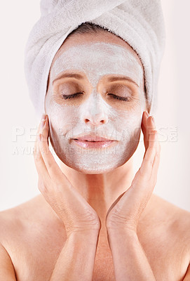 Buy stock photo Face, mask or woman in studio for facial or skincare routine with natural detox or cosmetics with towel. Model, spa or female person with lotion for anti aging treatment or beauty on white background